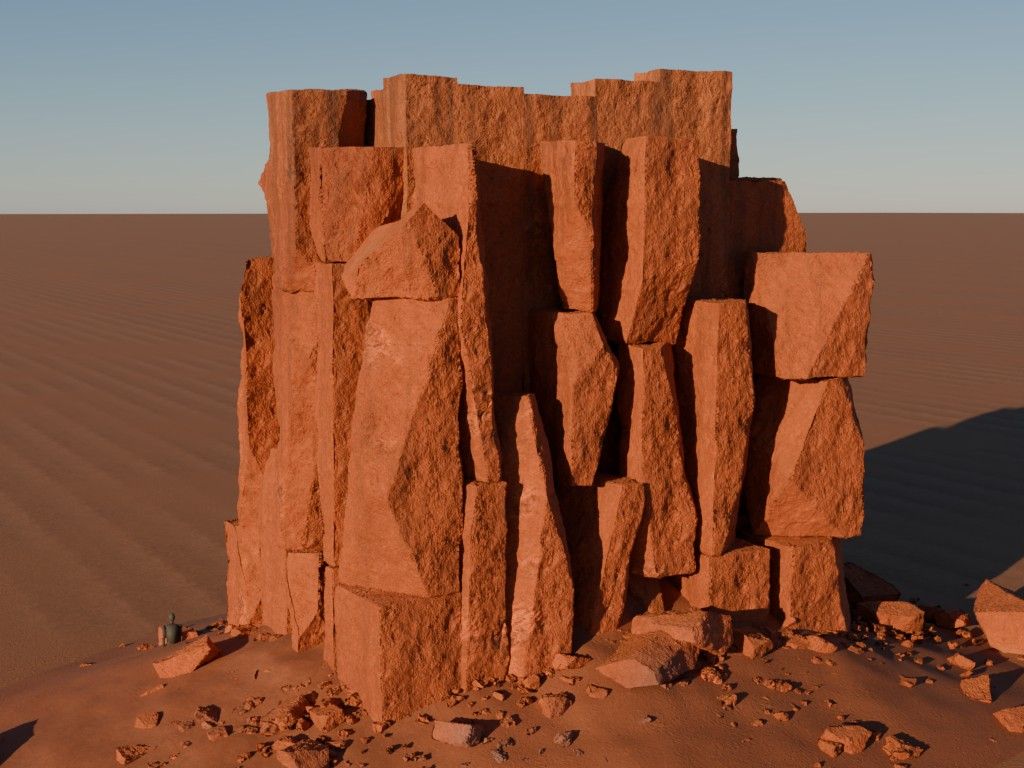 A tall red sandstone outcrop of stacked broken blocks